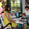 Sam helps Meg unwrap presents